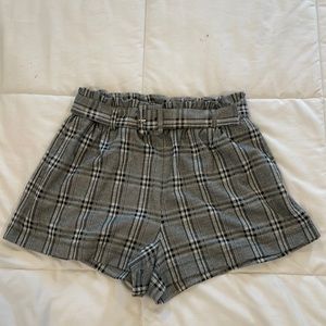 American Eagle size medium black and white plaid high waisted shorts.